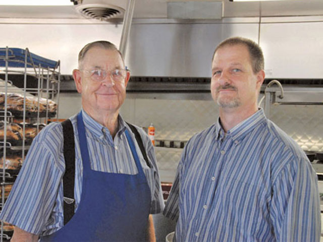 Think your workdays are busy? Try serving up orders for some 525 cars, the average on any given Friday at Dude’s Drive-In for Dude and Blake Griffith, right.