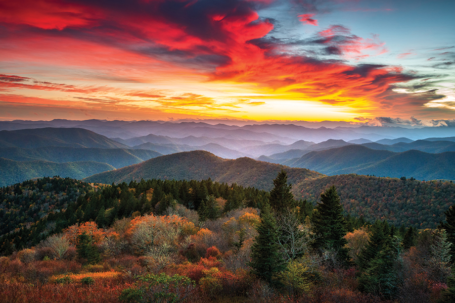 Cowee Mountains Overlook, Milepost 430.7 of the Blue Ridge Parkway in Western North Carolina. From the photographer: “A breathtaking autumn sunset over distant mountain ridges builds the warm tones of fall foliage.”
