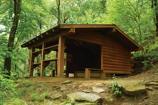 Wayah Shelter (NC). This Nantahala-style shelter is one of the newest in North Carolina. Built in memory of Ann and Larry McDuff, thru-hikers and Appalachian Long Distance Hikers Association (ALDHA) members, it is located north of the Wayah Bald stone lookout tower (5,342 feet), which was built by the Civilian Conservation Corps in 1937, renovated in 1983, burned by wildfire in 2016 and re-opened in 2018.