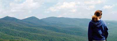 OFF THE BLUE RIDGE PARKWAY. A visitor views North Carolina’s Pisgah National Forest.