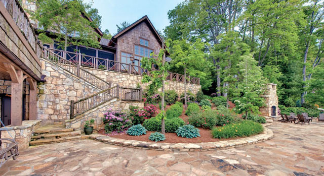 Gardens are terraced behind the Dodson home to open up unobstructed views of western North Carolina’s Lake Toxaway.