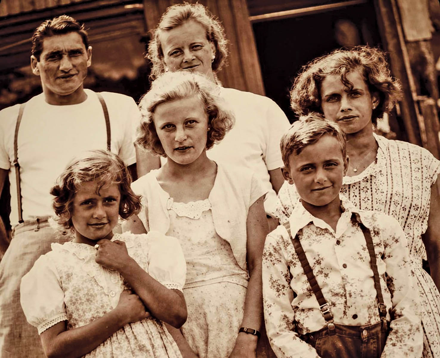 A happy 8-year-old Eula Mae standing in front of her father, Woodrow, in this Golding family photo taken in 1952.