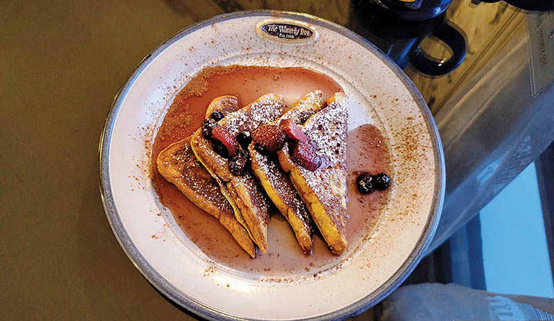 The Waverly Inn’s French toast is topped with fresh berry compote.
