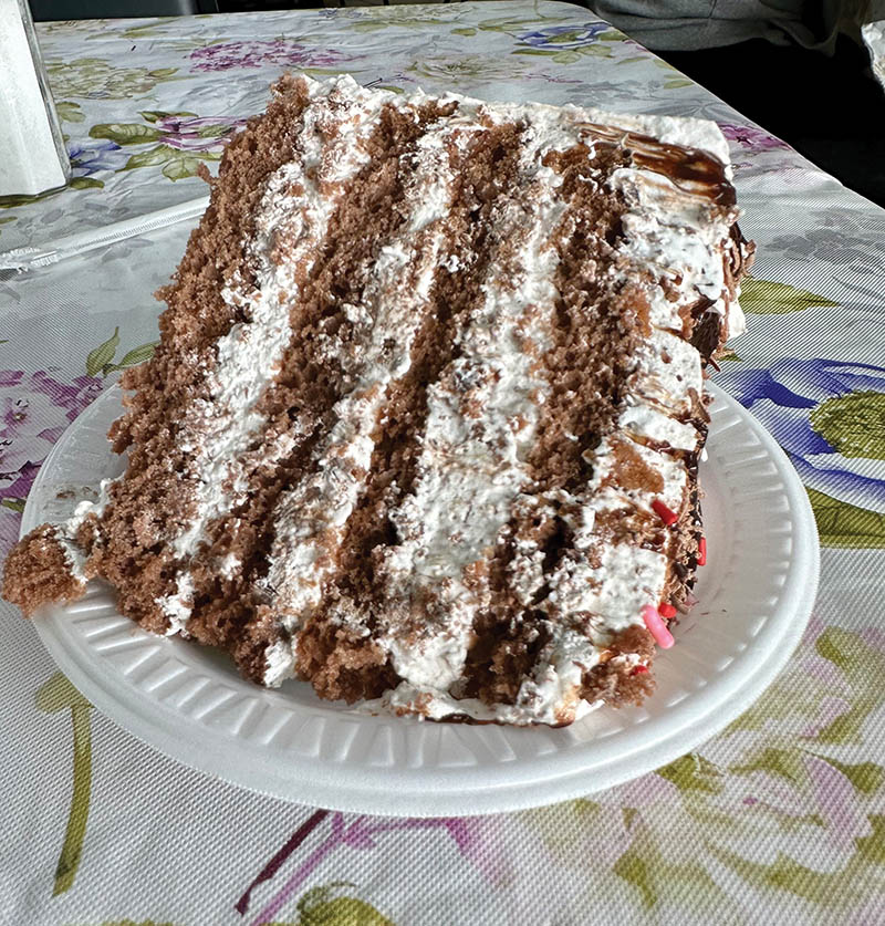 Customers understand the importance of ordering desserts like this Hershey Bar Cake as soon as they arrive.