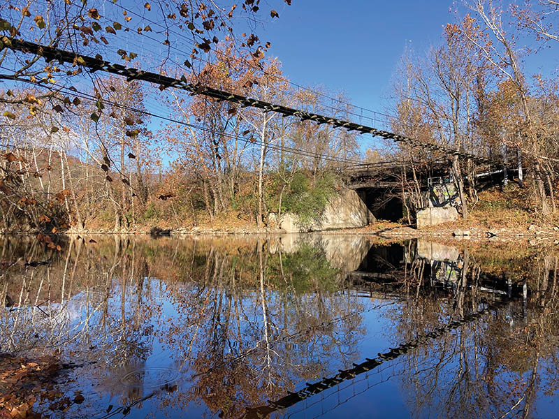 The swinging bridge as it looks today, stretching across the Jackson River at the end of River Street.