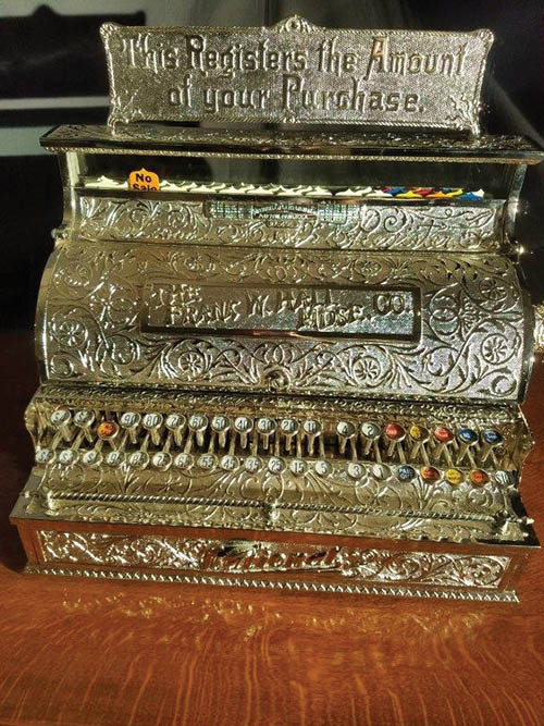 The elaborate, nickel-plated cash register, now encased in glass at The Smith House, dates to the 1880s.