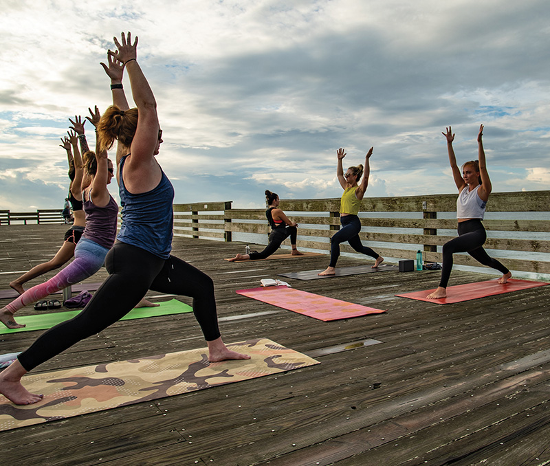Crystal Pier Vertical Low Lunge Pose at Sunrise Yoga Class