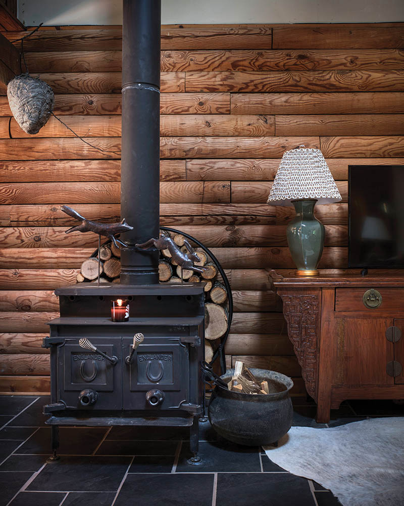 
Firewood from downed trees on the property keeps the original wood stove burning