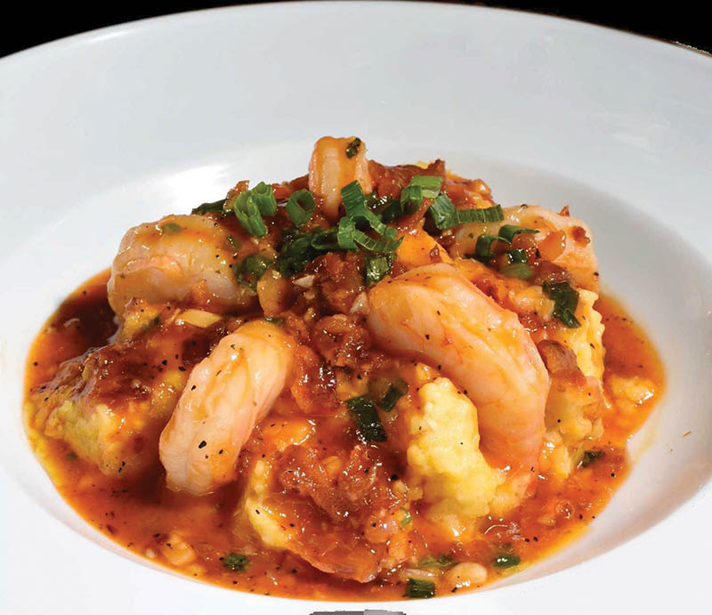 The Presidential Shrimp & Grits dish is topped with smoked tomato gravy.