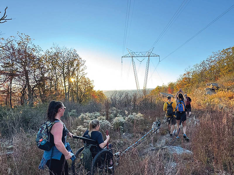 Fellow hikers accompany Pearson on the trek to McAfee.