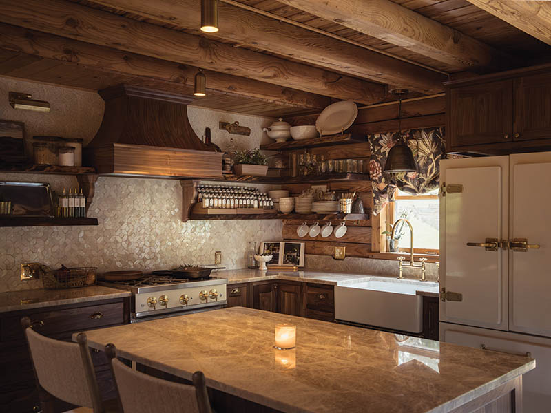Pairing locally crafted walnut cabinetry and shelving with the quartzite island added warmth and character to the kitchen.