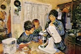 Sam and Eli Reynolds assist Elaine Ingram in preparing pawpaw/wild black walnut bread.