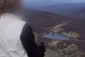 Gail Rheinheimer looks out over the view from Sharp Top.