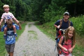 Matthew, left, carries l'il bro Grayson while Lily leads Dad Carl up the Star Trail.