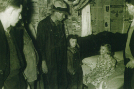 Bertha Sybert, 1938. Neighbors and newspaper writers came to the Sybert home to watch the phenomenon of Bertha on the bed.