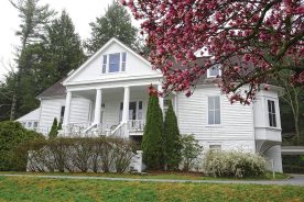 The Sandburg home is reflected in Front Lake.