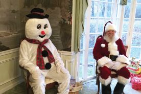 Modern-day Frosty (Mike Ryan) hangs out with Santa Claus in Keyser, West Virginia.