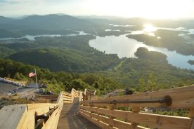 Mountain view of a forest valley containing Lake Chatuge at sunset | Blue Ridge Country
