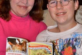 Marla Milling and son Ben, 15, leaf through the 2013 edition of “The Old Farmer’s Almanac.”