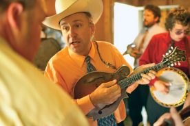 Musicians such as David Davis and the Warrior River Boys – performing here at a Ralph Stanley Festival – keep mountain music alive along the Crooked Road.