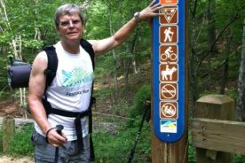 Kurt at start of walk, foolishly trying to point out that on word on the sign is spelled "Yeild."