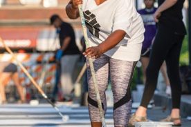 Jenny Pickens works on a mural in downtown Asheville, North Carolina.