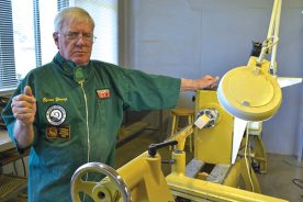 Byron Young, president of the West Virginia Mountaineer Woodturners, explains the different types of wood lathes at their workshop.