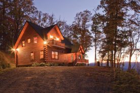 Round-cut logs and timber frame accents create a distinctive look.
