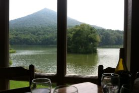 Looking out over Abbott Lake onto Sharp Top from inside the Peaks of Otter Lodge Restaurant.