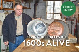 Kevin Riddle displays two reproduction copper pots from Virginia’s Jamestown Settlement. He has mostly restored the pot on the left; the one on the right has not been re-tinned yet.