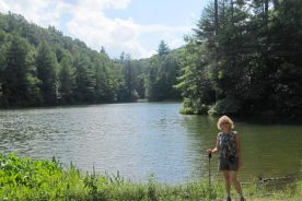 The Greatest Day Hiker Of Them All pauses at Hale Lake, while still pretty oblivious to the storms preparing to brew up behind her.