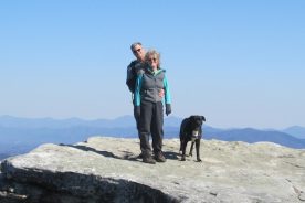 Kurt, Gail and Cookie on McAfee Knob, with the Peaks of Otter behind them on the horizon, 2/24/13; 9 years and one week into the hiking oddity.