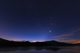 Venus and Jupiter shine above Fontana Lake and the Smoky Mountains.