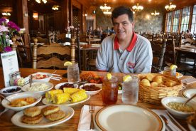John Dillard, Jr., shows off the farm-to-table dinner feast at the Dillard House Restaurant.