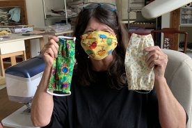 Joy Boothe shows a few of her masks