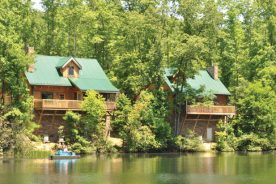 The Breaks Interstate Park cabins overlook Laurel Lake, where visitors can paddle a canoe.