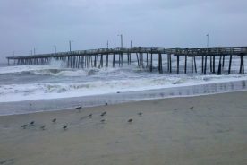 High surf under the pier.