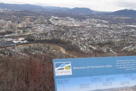 With strong rains only hours behind, the river far below the Mill Mountain overlook ran deep and muddy, but stayed within its banks. (Note the recently installed guide to area mountains at the overlook.)