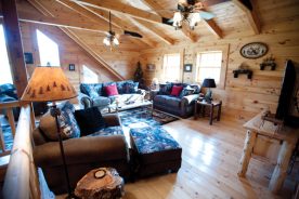 Ron and Pam Musick’s log home features vaulted ceilings in the living room, three bedrooms and a spacious kitchen.