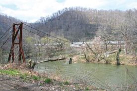 Undated photo shows the remains of the original swinging bridge from Vulcan, West Virginia, across the Tug River to Kentucky.