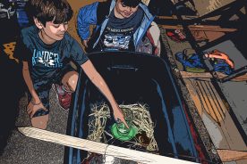 Eli and Sam share duties with Charlotte’s new chicks.