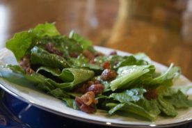 Killed lettuce is given much of its distinct taste by well-heated vinegar-sugar dressing.