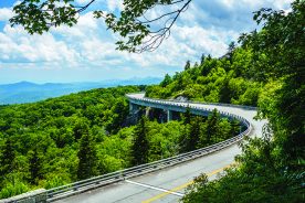 The Blue Ridge Parkway’s signature structure, the Linn Cove Viaduct, helps lure visitors.