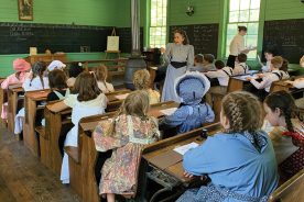 At Oak Hill School, relocated to Jonesborough, Tennessee in 1996, students spend the day under the tutelage of Jean Smith as they re-create the way things were in 1892, including having beef jerky for lunch.