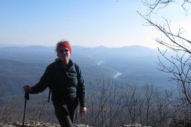 The James River snakes its way toward Richmond far below the Little Rocky Row viewpoint; The Day Hiker complains about another photo with her in it.