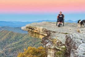 Carly Pearson smiles at the summit of McAfee Knob in Virginia