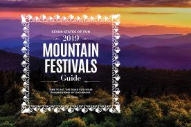 Sunset over a mountain range festival guide cover | Blue Ridge Country