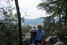 The Day Hiker and her dog, with Carvins Cove in the background.