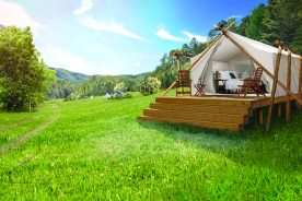 Under Canvas offers luxury tents with private bathrooms, decks, king-size beds and wood stoves.