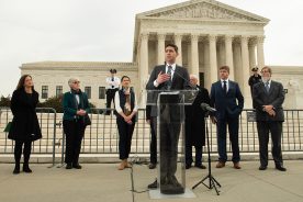 DJ Gerken, new executive director at SELC, conducts a press conference in front of the U.S. Supreme Court Building.
